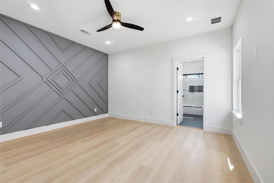 Corridor with baseboards and light wood-type flooring Corridor with baseboards and light wood-type flooring