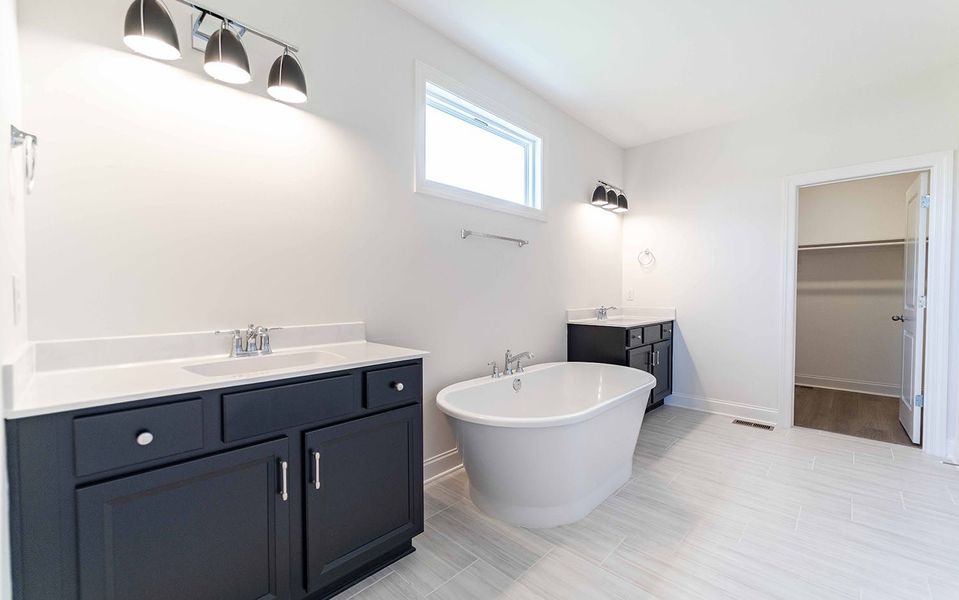 Furnished interior view inside a new home in Aden Woods, Fairview (Image 10).