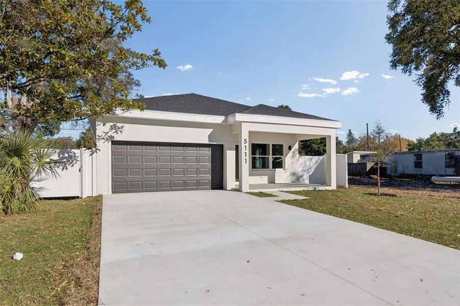 Front exterior of a new home in , St. Petersburg, FL, highlighting curb appeal (Image 28). Front exterior of a new home in , St. Petersburg, FL, highlighting curb appeal (Image 28).