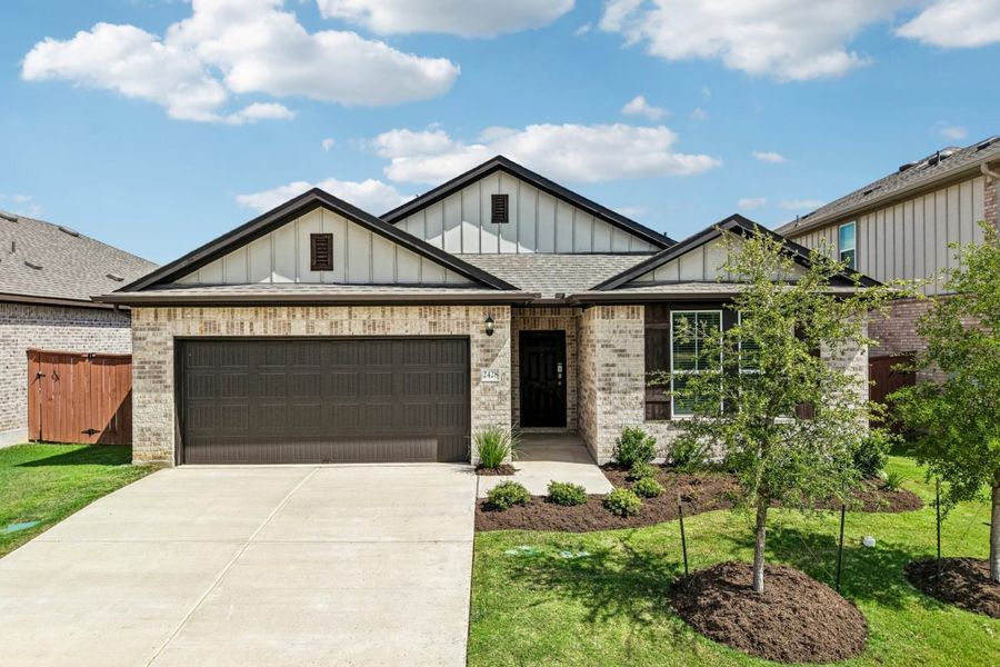 Front exterior of a new home in Oaks at San Gabriel, Georgetown, TX, highlighting curb appeal (Image 2). Front exterior of a new home in Oaks at San Gabriel, Georgetown, TX, highlighting curb appeal (Image 2).