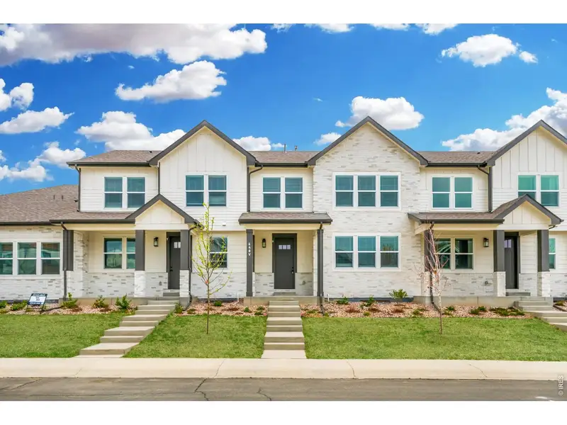 Front exterior of a new home in , Windsor, CO, highlighting curb appeal (Image 1). Front exterior of a new home in , Windsor, CO, highlighting curb appeal (Image 1).