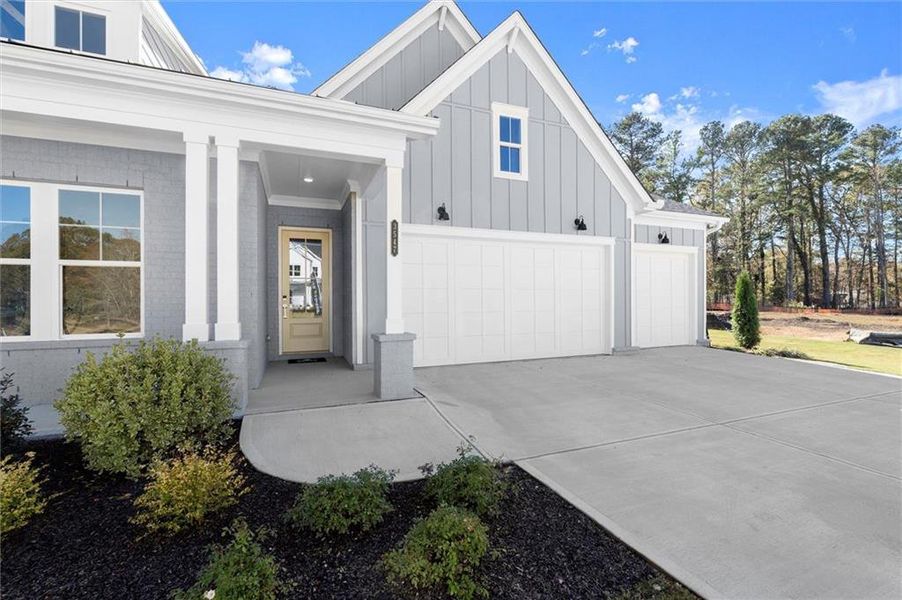 Front exterior of a new home in Hillgrove Preserve, Powder Springs, GA, highlighting curb appeal (Image 21).