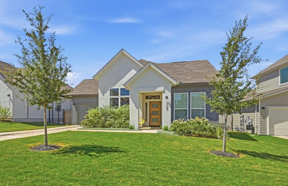 Front exterior of a new home in Loyola, Austin, TX, highlighting curb appeal (Image 21).