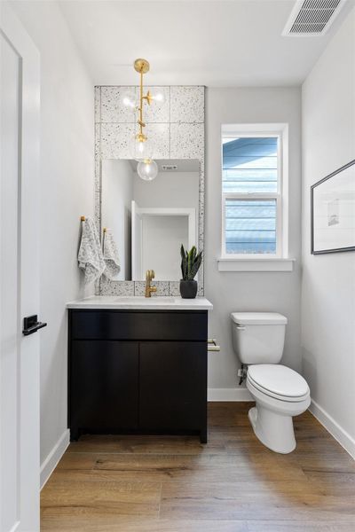 Bathroom with vanity and light wood-style floors