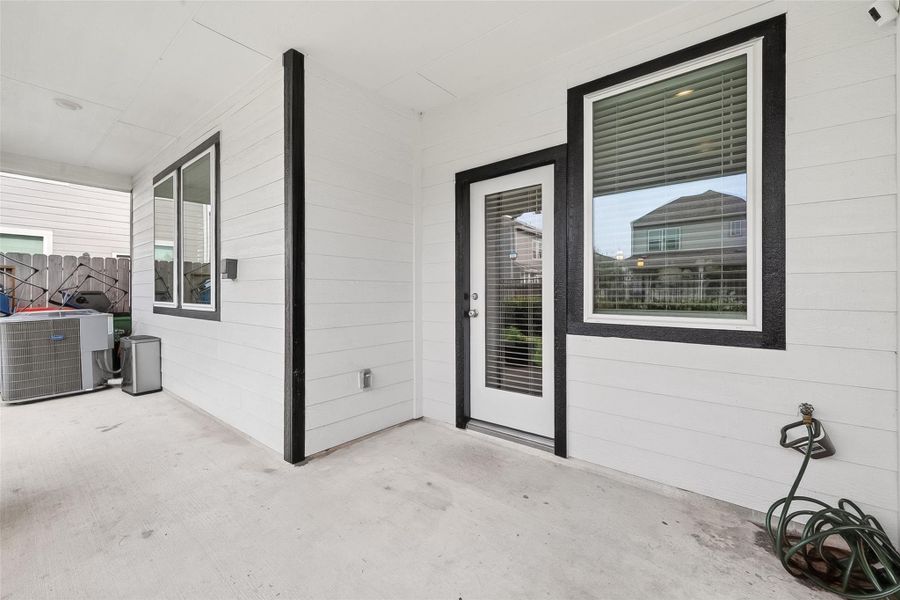 Exterior details and patio area of a home in McClendon Park Village, Houston (Image 26).