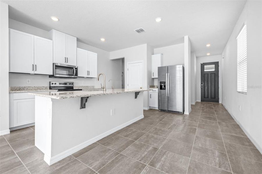Furnished interior view inside a new home in The Grove at Stuart Crossing - Premier Series, Bartow (Image 8).