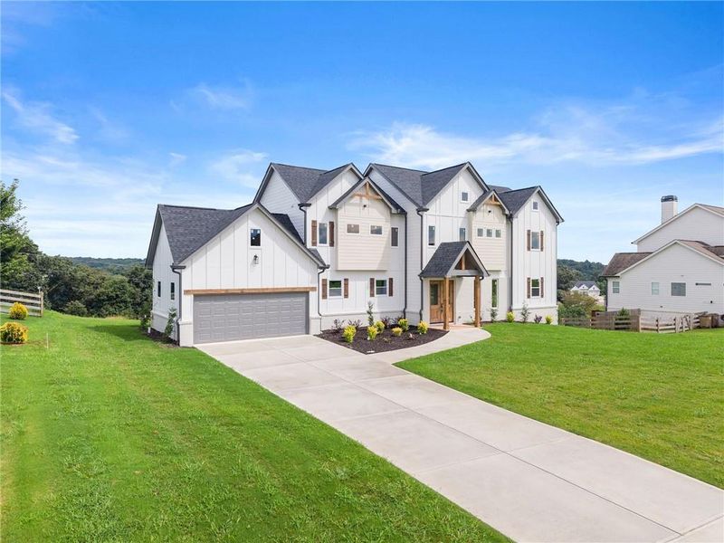 Front exterior of a new home in , Clermont, GA, highlighting curb appeal (Image 27).