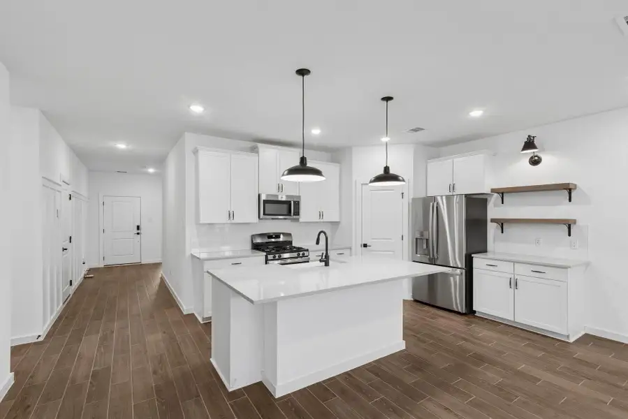 Stylish island kitchen with floating shelves