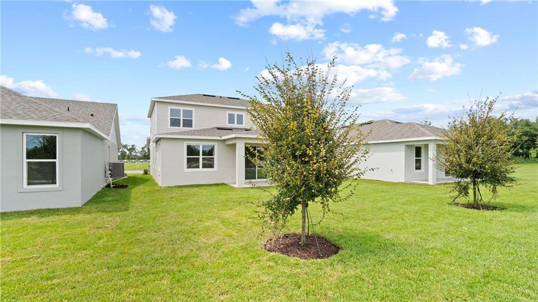 Front exterior of a new home in Trailside, Mount Dora, FL, highlighting curb appeal (Image 22).