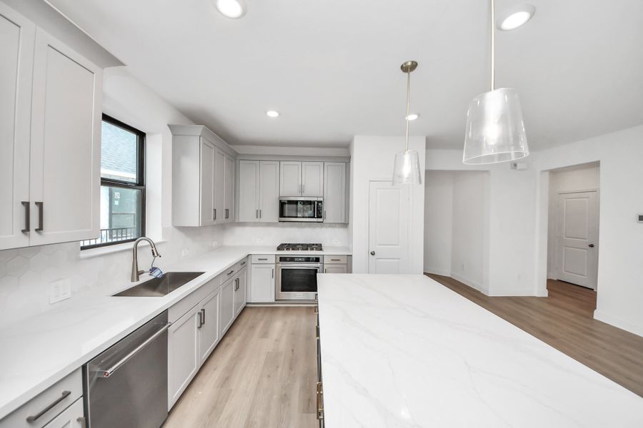 Furnished interior view inside a new home in Bridgeland, Cypress (Image 16).
