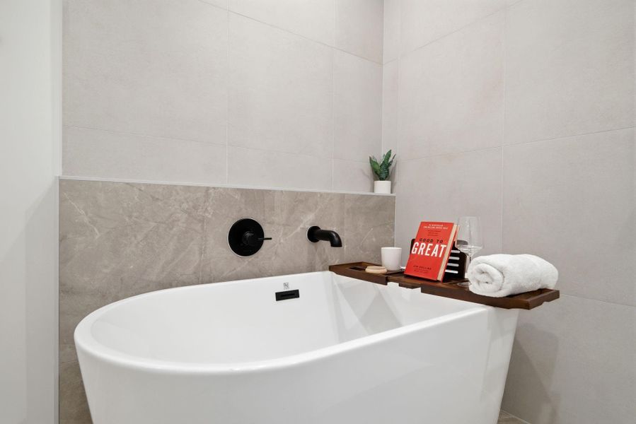 Experience ultimate relaxation in this stunning luxury spa-inspired bathroom, featuring a spacious central freestanding bathtub as its centerpiece. Experience ultimate relaxation in this stunning luxury spa-inspired bathroom, featuring a spacious central freestanding bathtub as its centerpiece.