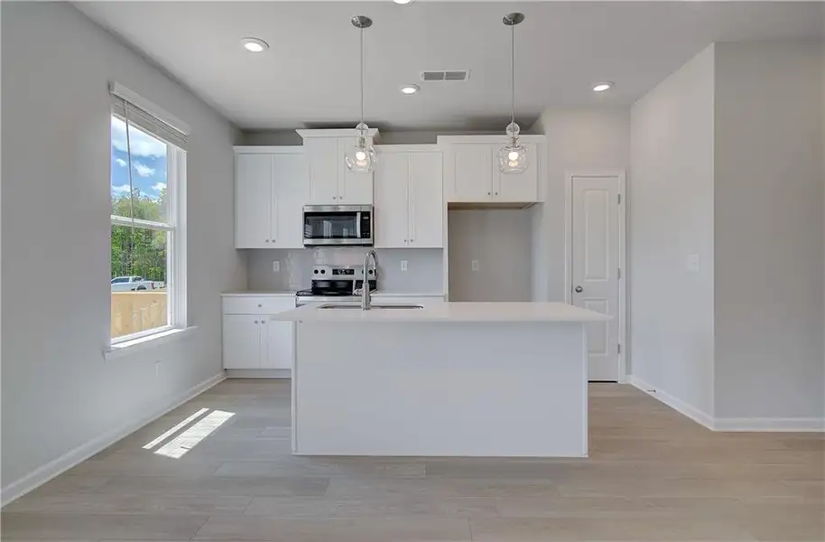 Furnished interior view inside a new home in Enclave at Evergreen, Fairburn (Image 4).