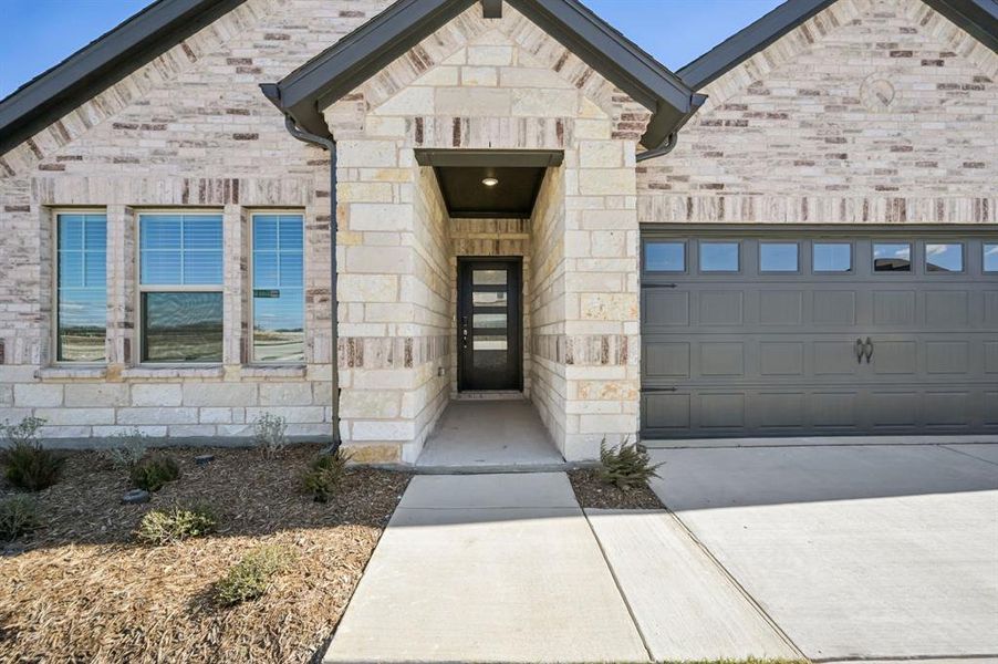 Exterior details and patio area of a home in Parks at Foster Crossing - Premier Series, Anna (Image 3).