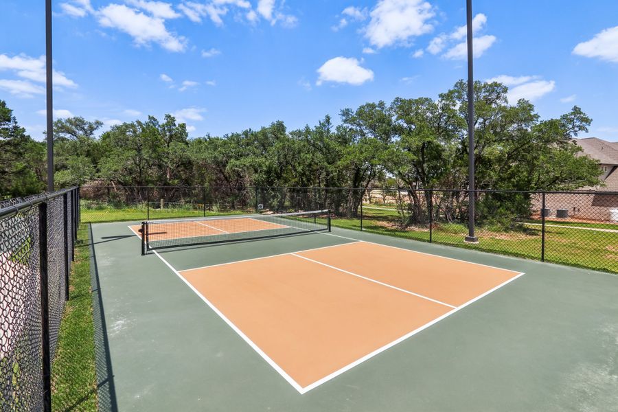 A tennis court with a net.