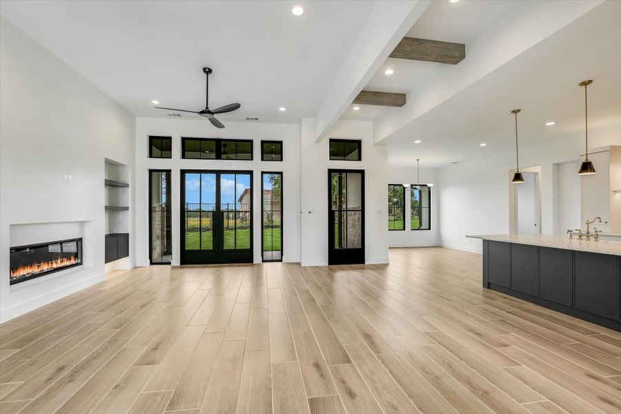 Open concept interior featuring wide plank wood-finish flooring