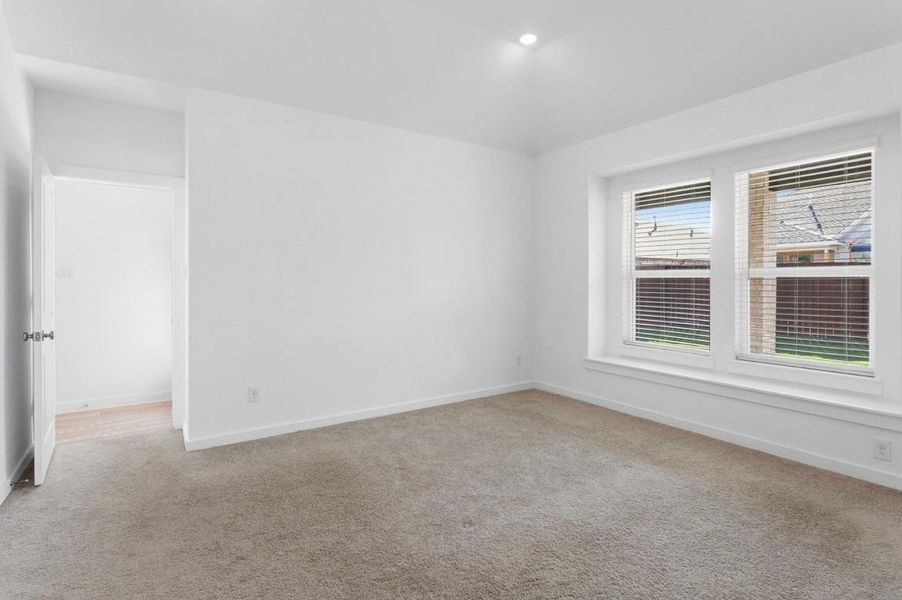 View of spacious master bedroom with plenty of natural light and peaceful retreat feel with blinds included. View of spacious master bedroom with plenty of natural light and peaceful retreat feel with blinds included.