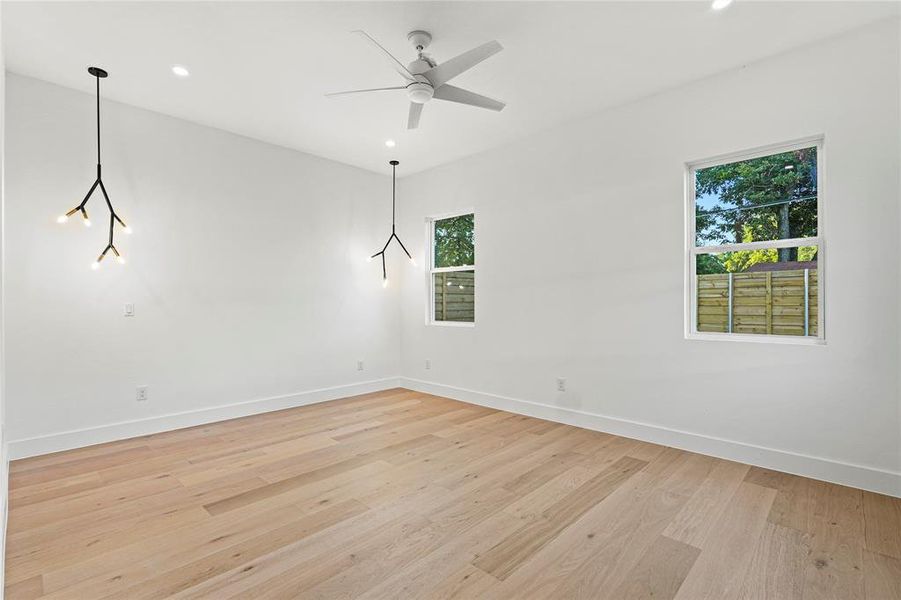 Spare room with light wood-type flooring, recessed lighting, and a ceiling fan