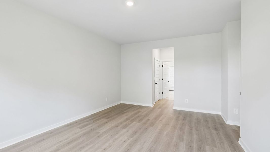 Representative unfurnished interior of a home built from the Ansley by D.R. Horton in Harvest Point, Spring Hill (Image 60).