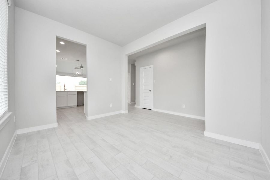 Make memories gathered around the table with your family and friends! This spacious dining room features elegant flooring, custom paint, and adjacent to family room and kitchen for open concept feel. Sample photo of completed home with similar floor plan. Actual colors and selections may vary. Make memories gathered around the table with your family and friends! This spacious dining room features elegant flooring, custom paint, and adjacent to family room and kitchen for open concept feel. Sample photo of completed home with similar floor plan. Actual colors and selections may vary.