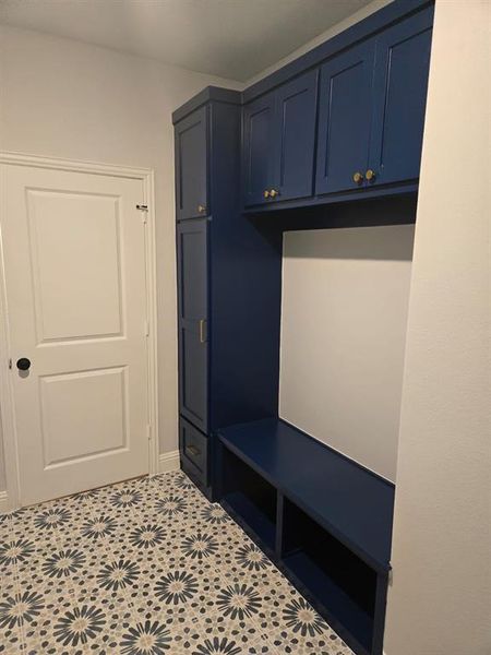 Mudroom featuring light tile patterned floors