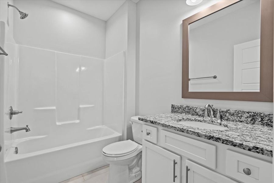 Representative furnished interior of a home built from the Roosevelt by Enchanted Homes in Guadalupe Heights, Seguin (Image 10).