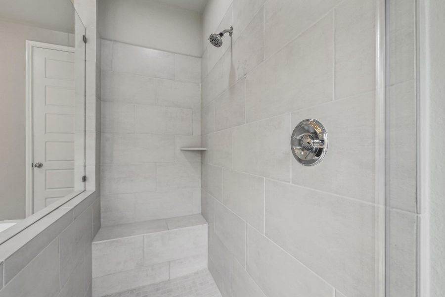 Bathroom featuring a tile shower Bathroom featuring a tile shower