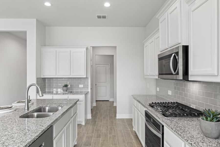 Representative exterior photo of a completed home built from the Hampton by Impression Homes in Timberbrook, Justin, TX (Image 7). Representative exterior photo of a completed home built from the Hampton by Impression Homes in Timberbrook, Justin, TX (Image 7).