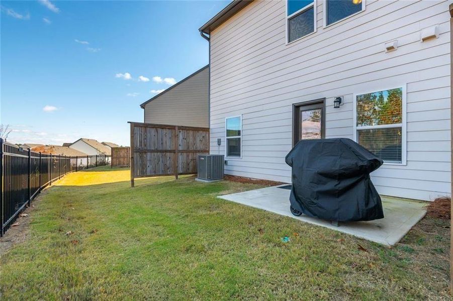 Exterior details and patio area of a home in Avignon - Townhomes, Cumming (Image 17). Exterior details and patio area of a home in Avignon - Townhomes, Cumming (Image 17).