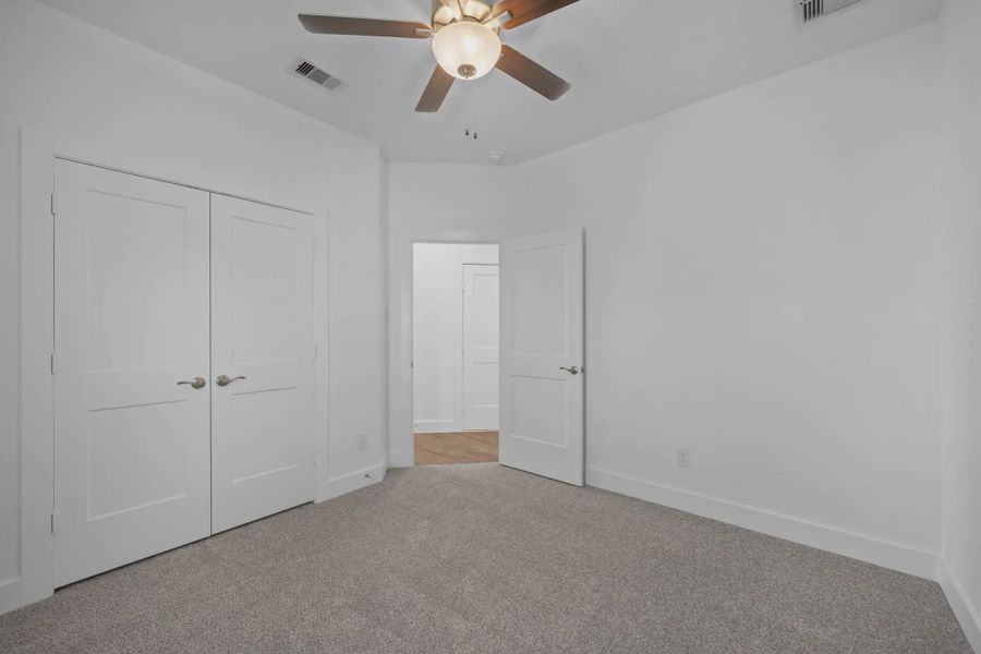 Representative unfurnished interior of a home built from the Carriagehouse by Chesmar Homes in Meridiana Townhomes, Iowa Colony (Image 81).