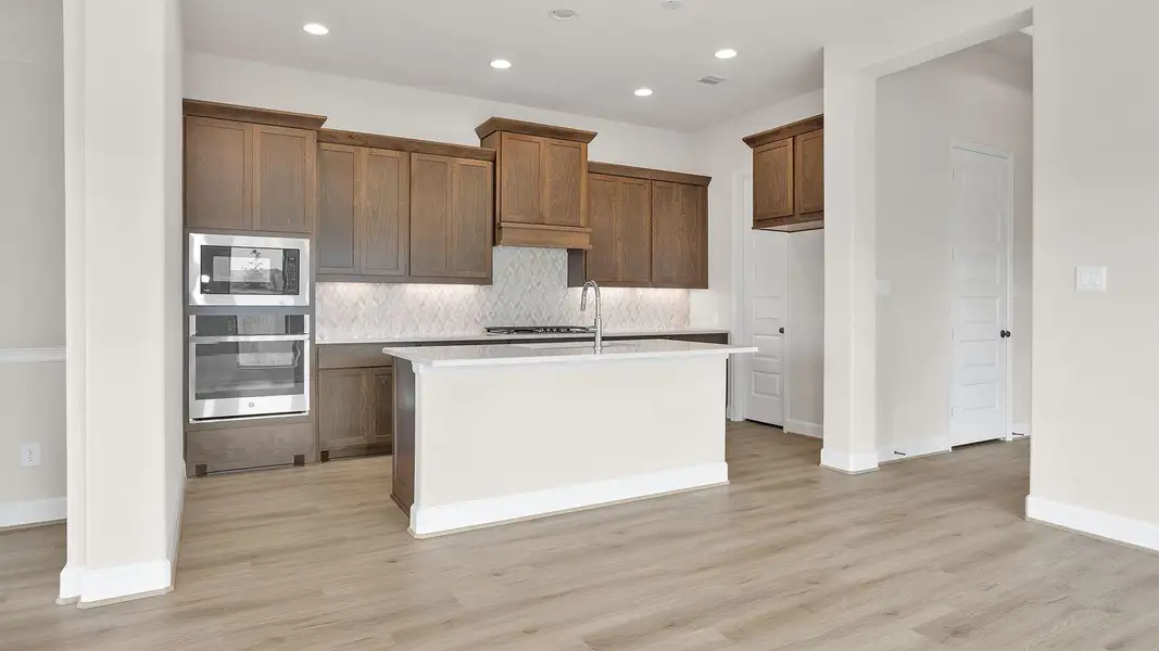 Furnished interior view inside a new home in Bridgeland, Cypress (Image 7).