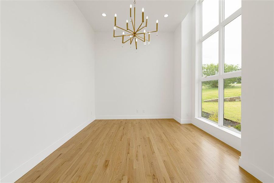 Study featuring a chandelier, light wood-type flooring, baseboards, and recessed lighting Study featuring a chandelier, light wood-type flooring, baseboards, and recessed lighting