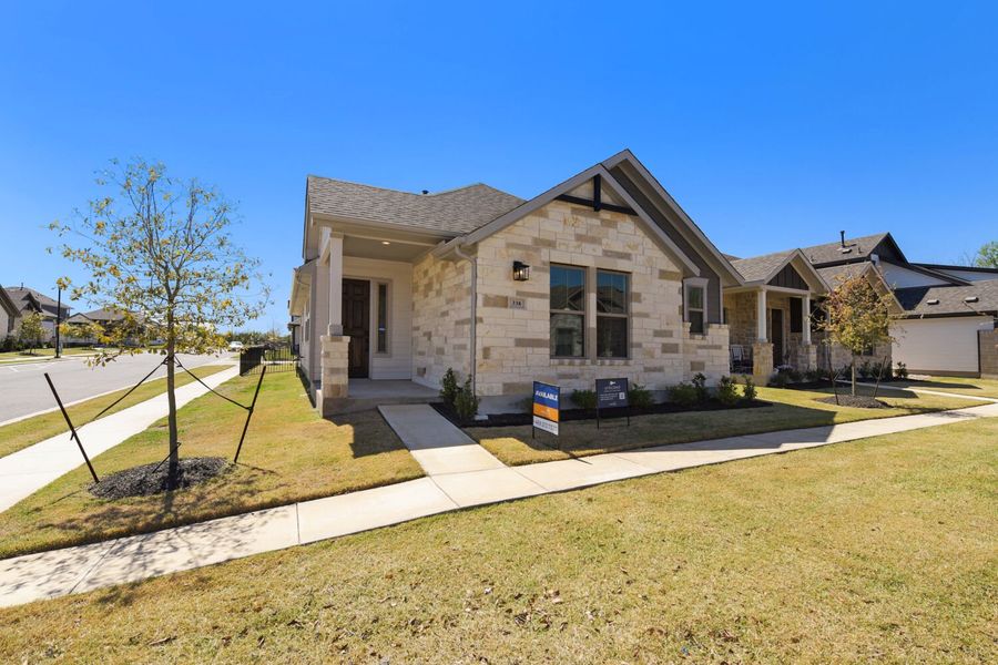 Front exterior of a new home in The Porch at Du Pre, Buda, TX, highlighting curb appeal (Image 1). Front exterior of a new home in The Porch at Du Pre, Buda, TX, highlighting curb appeal (Image 1).
