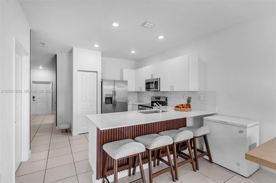 Furnished interior view inside a new home in , Miami (Image 14). Furnished interior view inside a new home in , Miami (Image 14).
