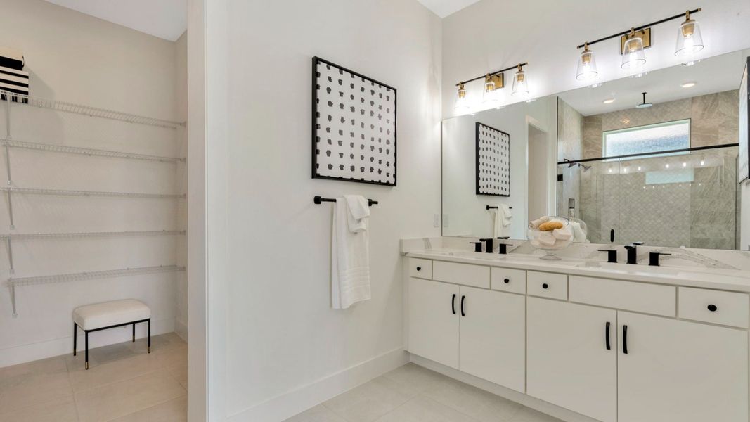 The Primary Bathroom of a DRB Homes Grand Eider model, which is a home plan offered at Serengeti in Spring Hill, FL.