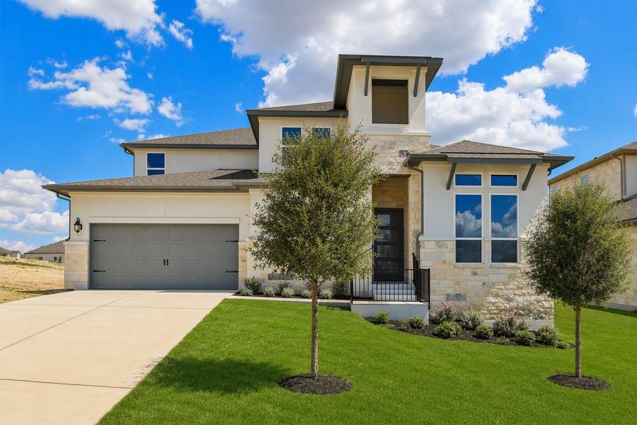 Representative exterior photo of a completed home built from the Rainey by Taylor Morrison in Santa Rita Ranch, Liberty Hill, TX (Image 26).