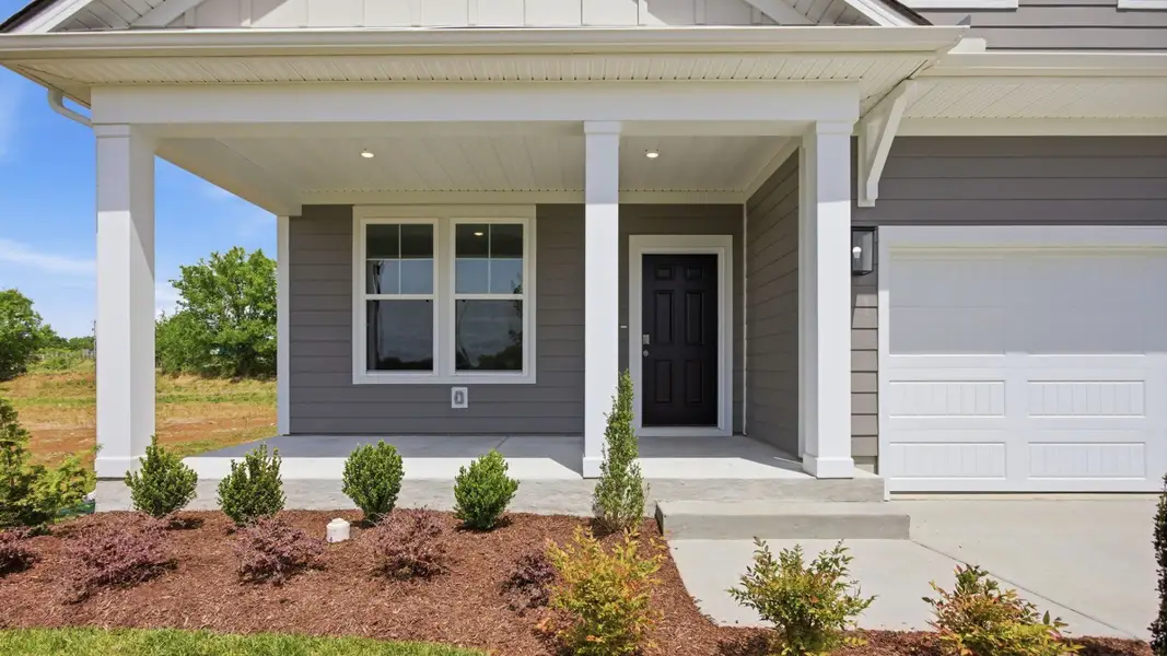 Exterior entryway with black door Exterior entryway with black door