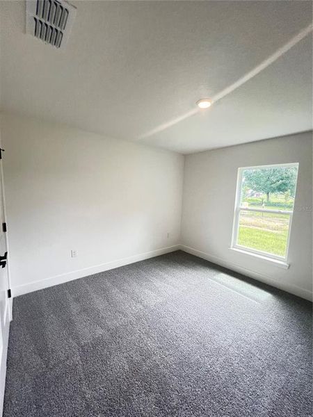 Spacious, unfurnished interior of a new home in Hill Country Estates, Dade City (Image 28).
