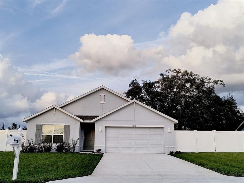 Front exterior of a new home in , Spring Hill, FL, highlighting curb appeal (Image 21).