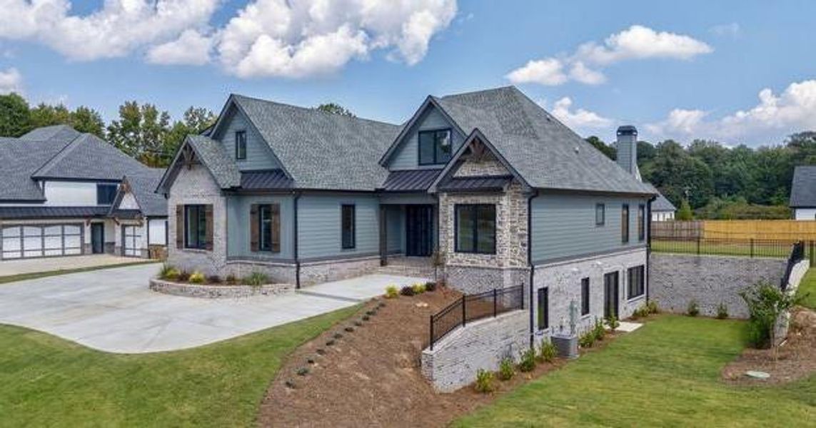 Front exterior of a new home in , Cumming, GA, highlighting curb appeal (Image 25).