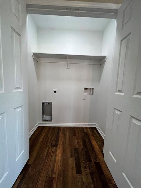 Washroom with dark wood-style floors, hookup for an electric dryer, and washer hookup