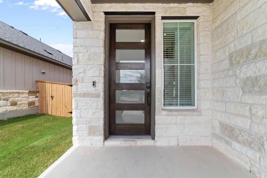 Exterior details and patio area of a home in Heritage, Dripping Springs (Image 3).