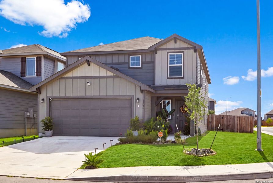 Front exterior of a new home in Red Hawk Landing, San Antonio, TX, highlighting curb appeal (Image 21). Front exterior of a new home in Red Hawk Landing, San Antonio, TX, highlighting curb appeal (Image 21).