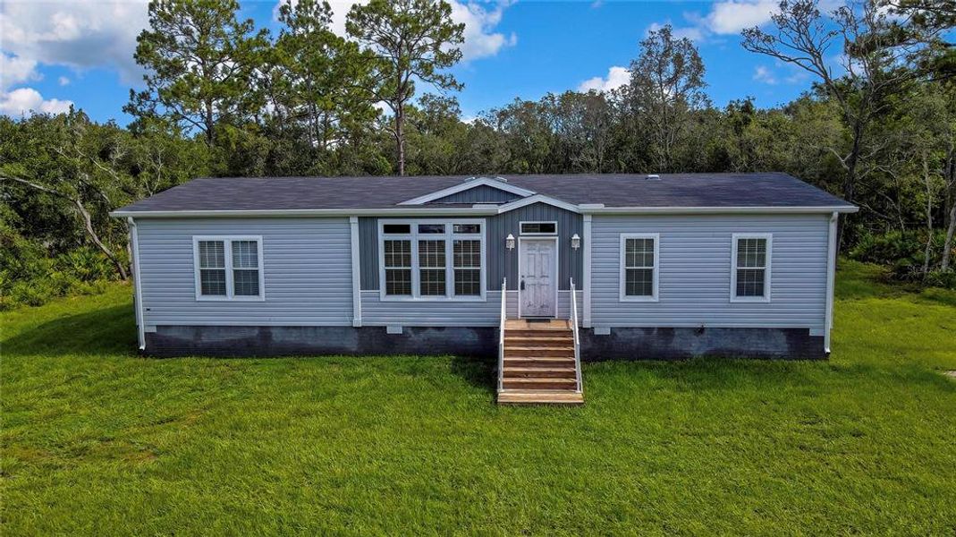 Front exterior of a new home in , Homosassa, FL, highlighting curb appeal (Image 2).