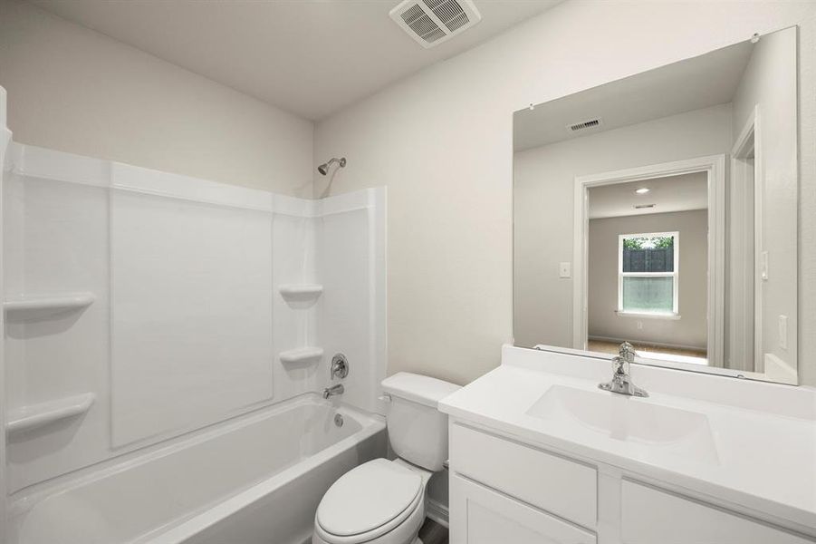 The primary bathroom has a shower/tub combo and a walk-in closet.