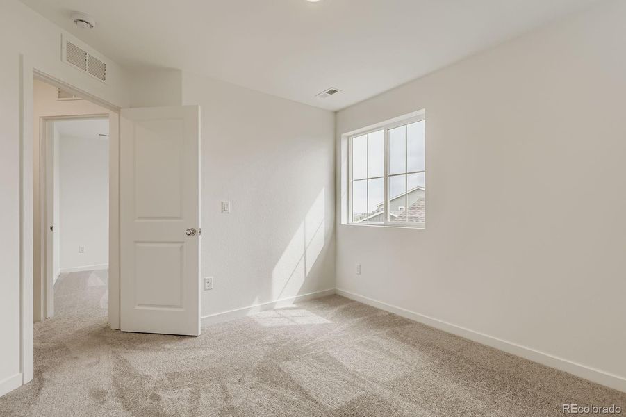 Spacious, unfurnished interior of a new home in Eastcreek Farm: Paired Homes, Thornton (Image 9).