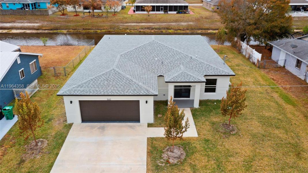 Front exterior of a new home in , Port St. Lucie, FL, highlighting curb appeal (Image 2). Front exterior of a new home in , Port St. Lucie, FL, highlighting curb appeal (Image 2).