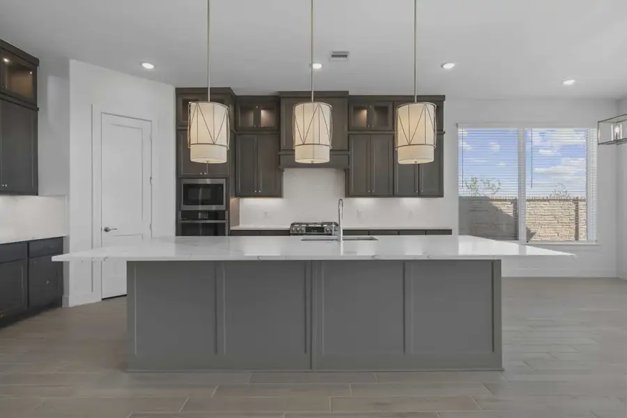 Representative furnished interior of a home built from the Waterford by Chesmar Homes in Meridiana 60's, Manvel (Image 8).
