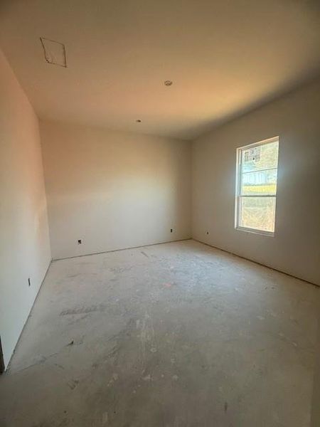 Bedroom with ensuite bath and walk in closet.
