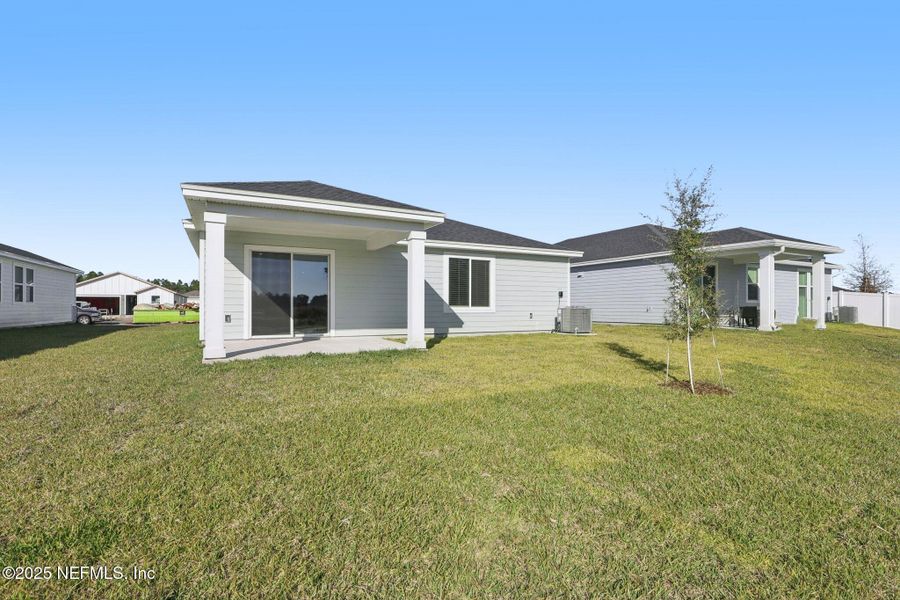 Exterior details and patio area of a home in Cypress Meadows - Signature Series, Jacksonville (Image 3).