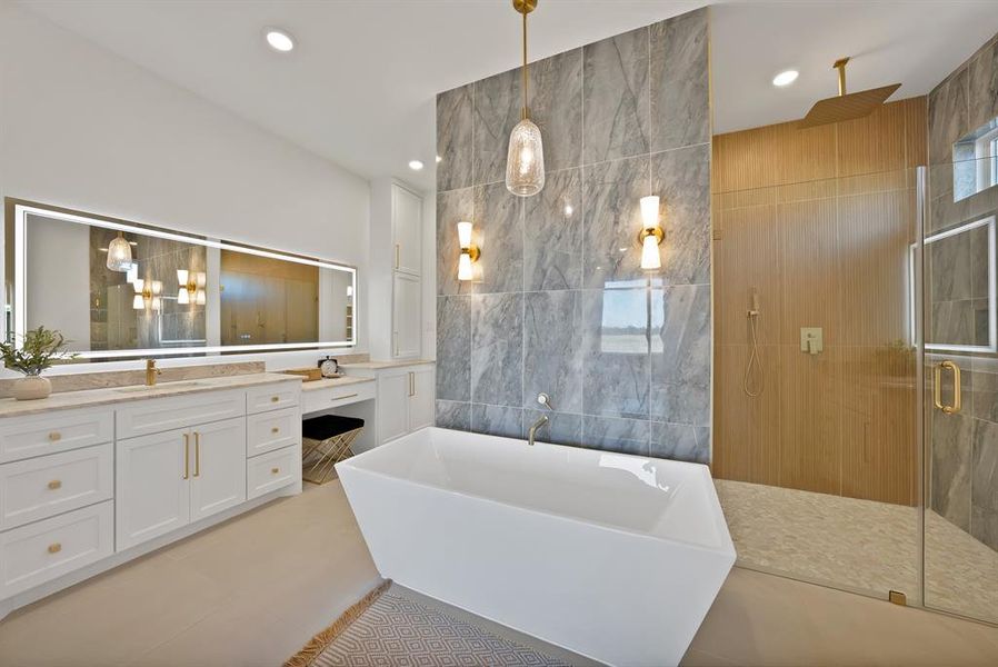Bathroom with tile walls, vanity, a soaking tub, a stall shower, and recessed lighting